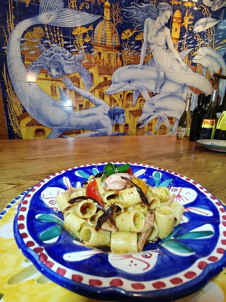 Traditional seafood dish served on colorful Vietri ceramic plate