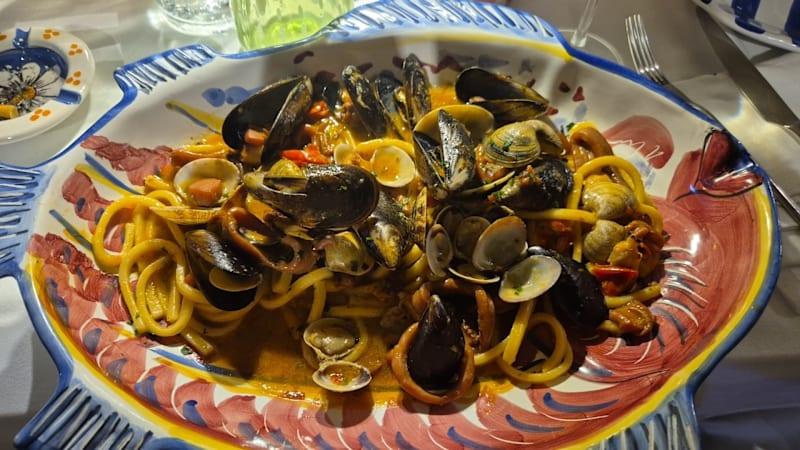 Fresh seafood pasta with Mediterranean ingredients in Vietri sul Mare