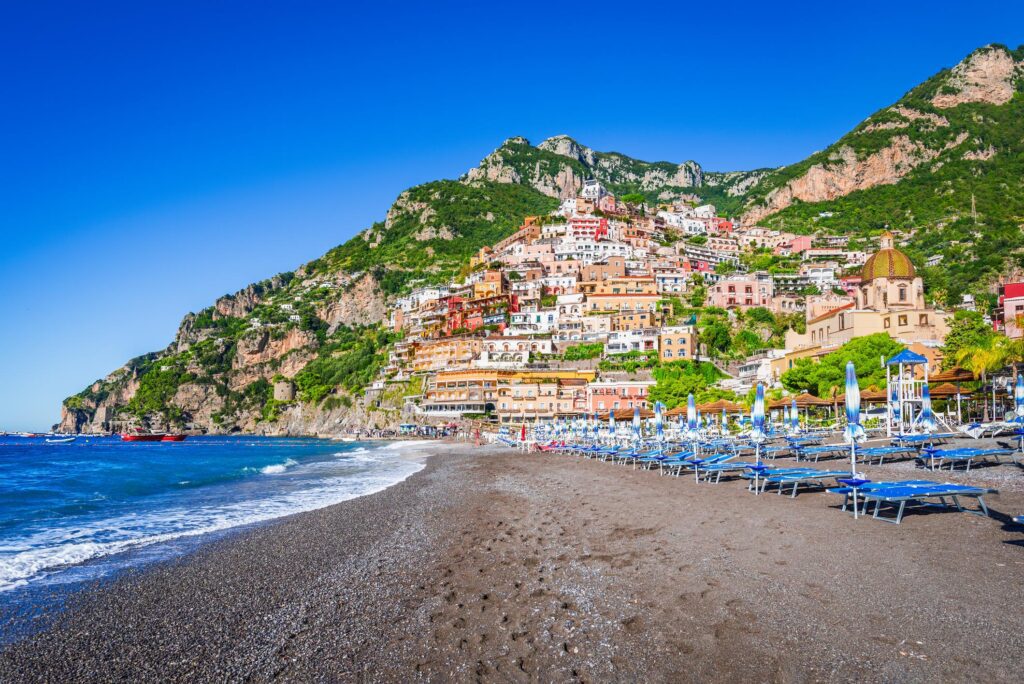 Positano beach and colourful buildings overlooking the waterfront